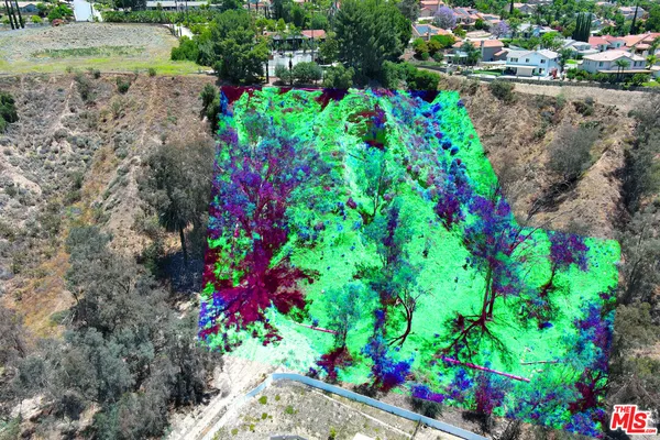 a view of a mountain with mountains in the background