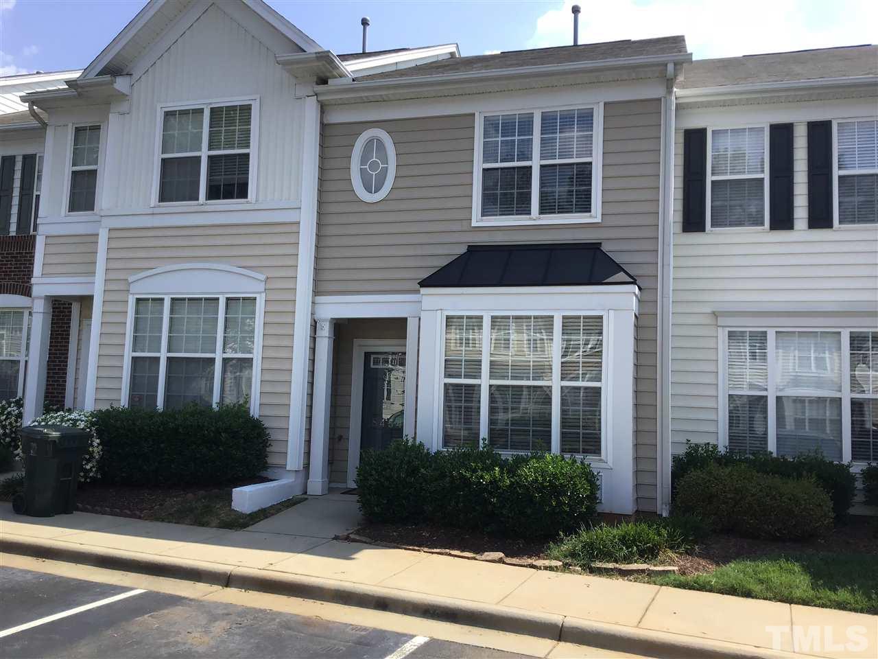 8454 Reedy Ridge Lane Raleigh, NC 27613 - Photo 1 of 30 a front view of a house with a garden