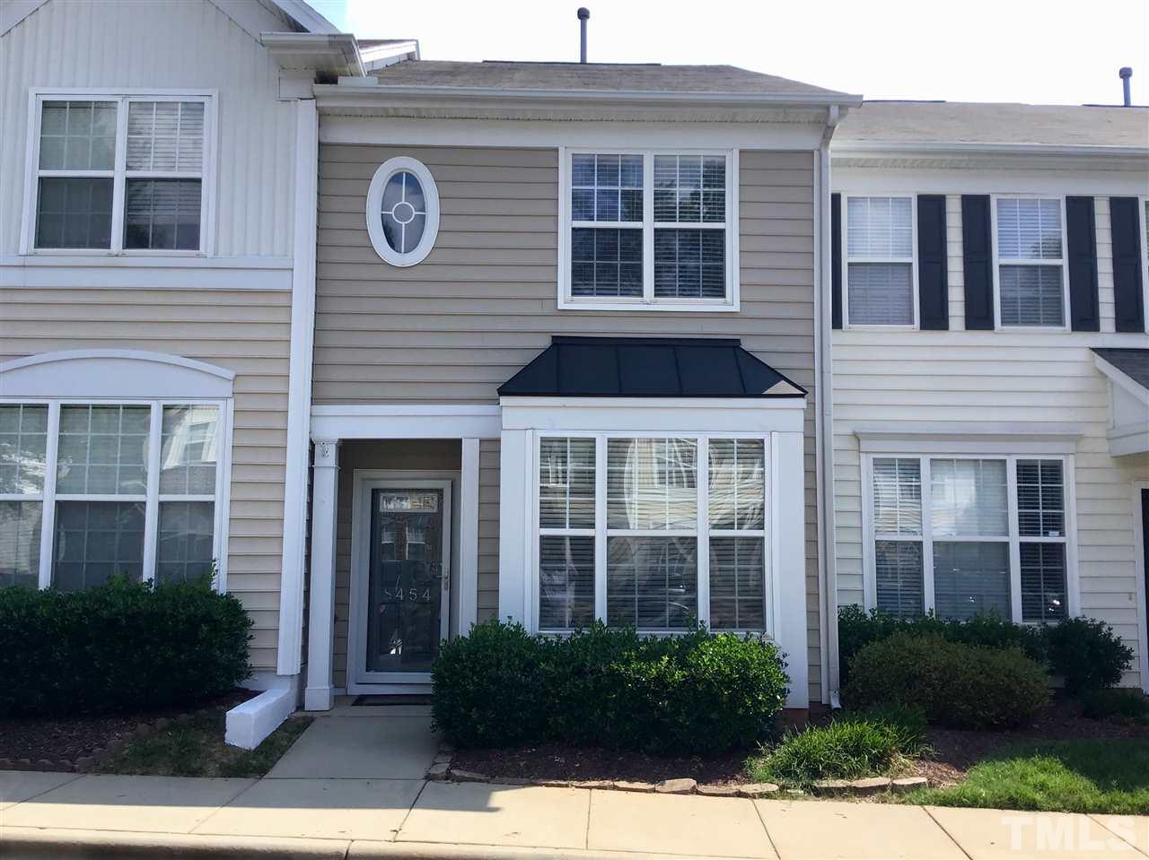 8454 Reedy Ridge Lane Raleigh, NC 27613 - Photo 2 of 30 a view of brick building with large windows