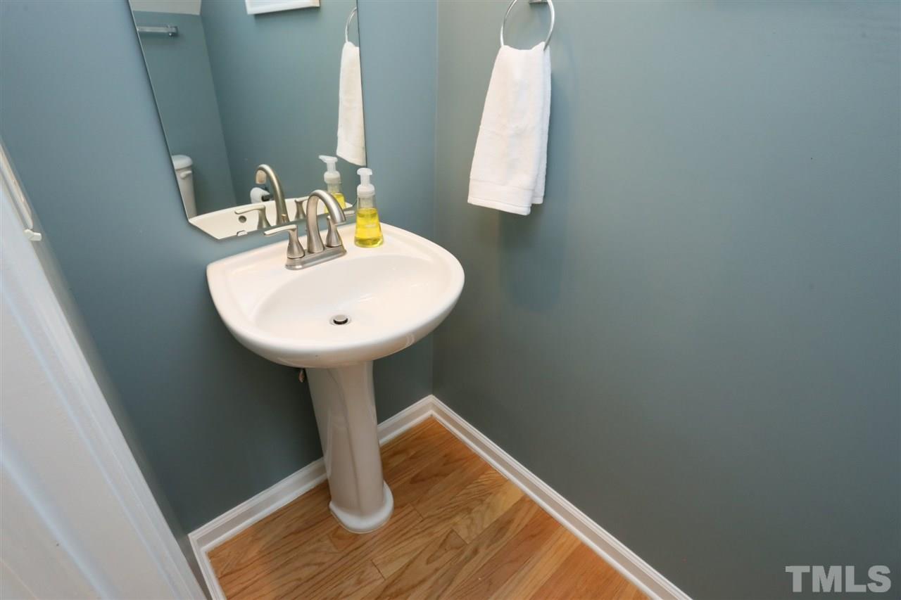 8454 Reedy Ridge Lane Raleigh, NC 27613 - Photo 15 of 30 a bathroom with a sink and a mirror