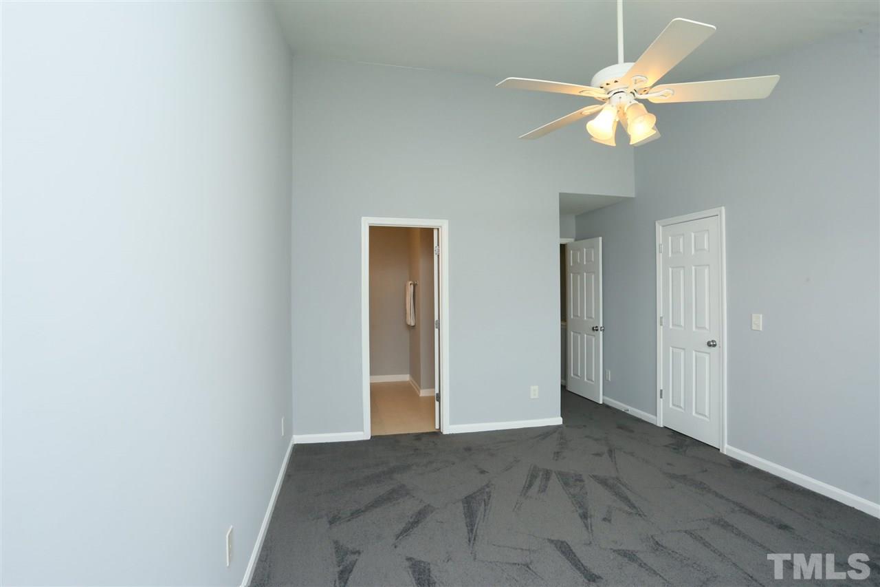 8454 Reedy Ridge Lane Raleigh, NC 27613 - Photo 18 of 30 a view of a bedroom with a chandelier fan