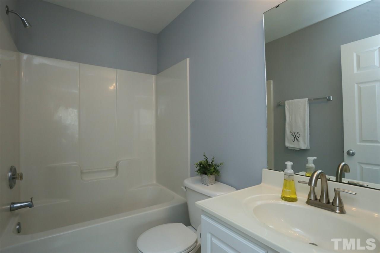 8454 Reedy Ridge Lane Raleigh, NC 27613 - Photo 22 of 30 a bathroom with a sink toilet and shower