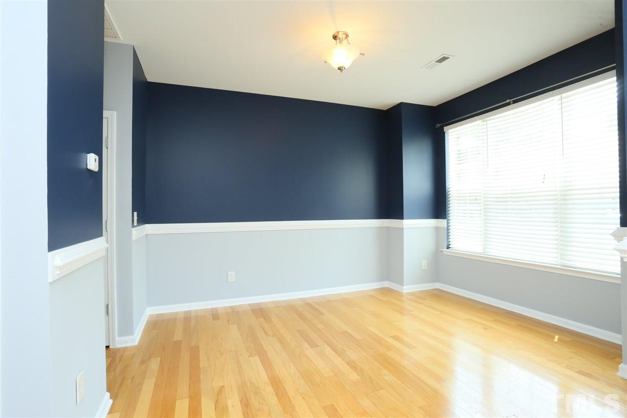 8454 Reedy Ridge Lane Raleigh, NC 27613 - Photo 4 of 30 a view of an empty room with a window