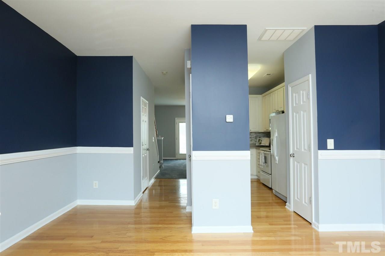 8454 Reedy Ridge Lane Raleigh, NC 27613 - Photo 5 of 30 a view of a hallway view with wooden floor and staircase
