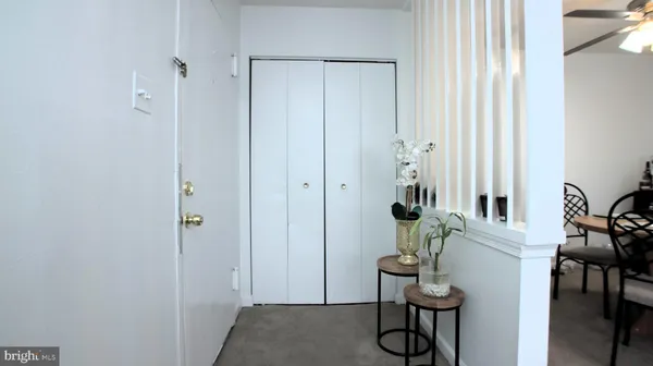 a view of entryway with livingroom