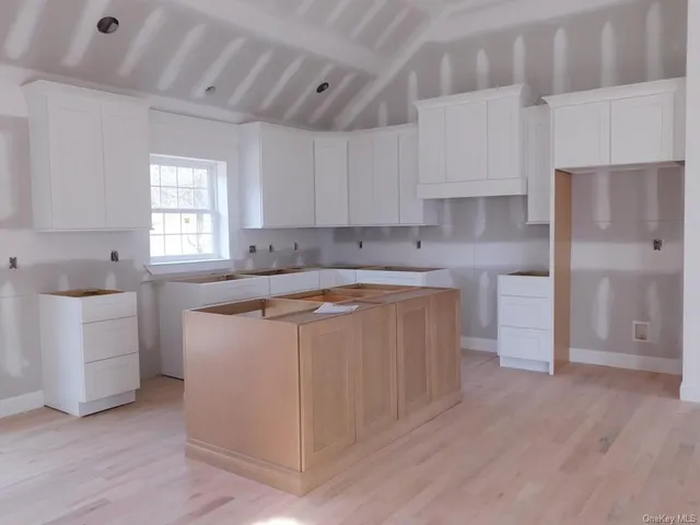 a utility room with cabinets dryer and washer