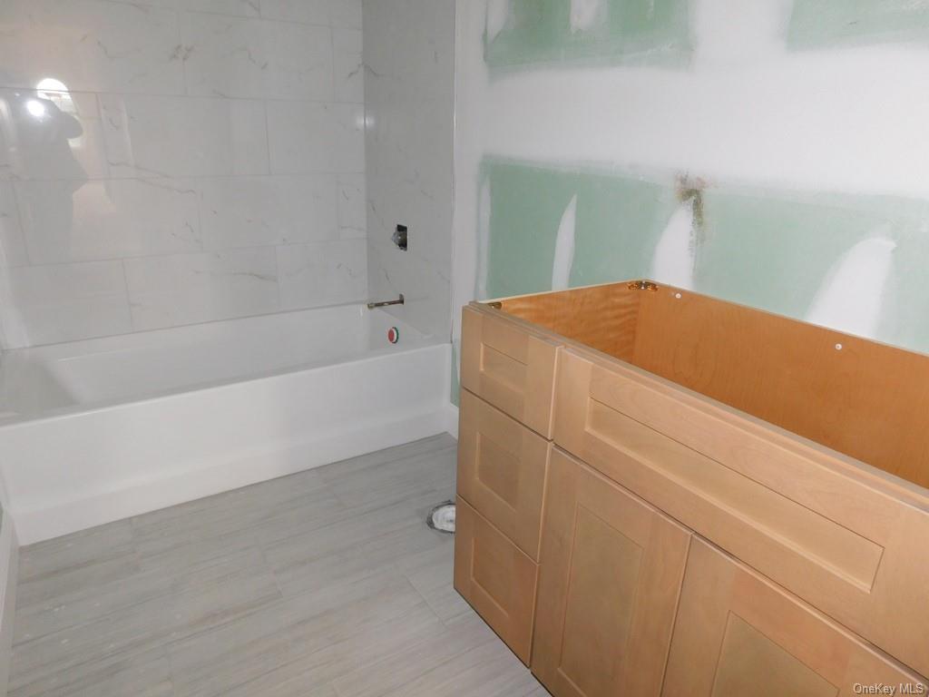 88 Quaker Street Wallkill, NY 12589 - Photo 16 of 24 a bathroom with a bathtub