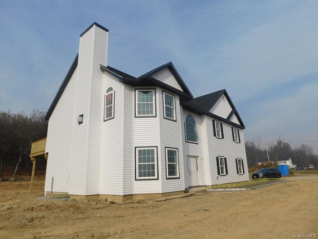 88 Quaker Street Wallkill, NY 12589 - Photo 24 of 24 a front view of a house with a yard