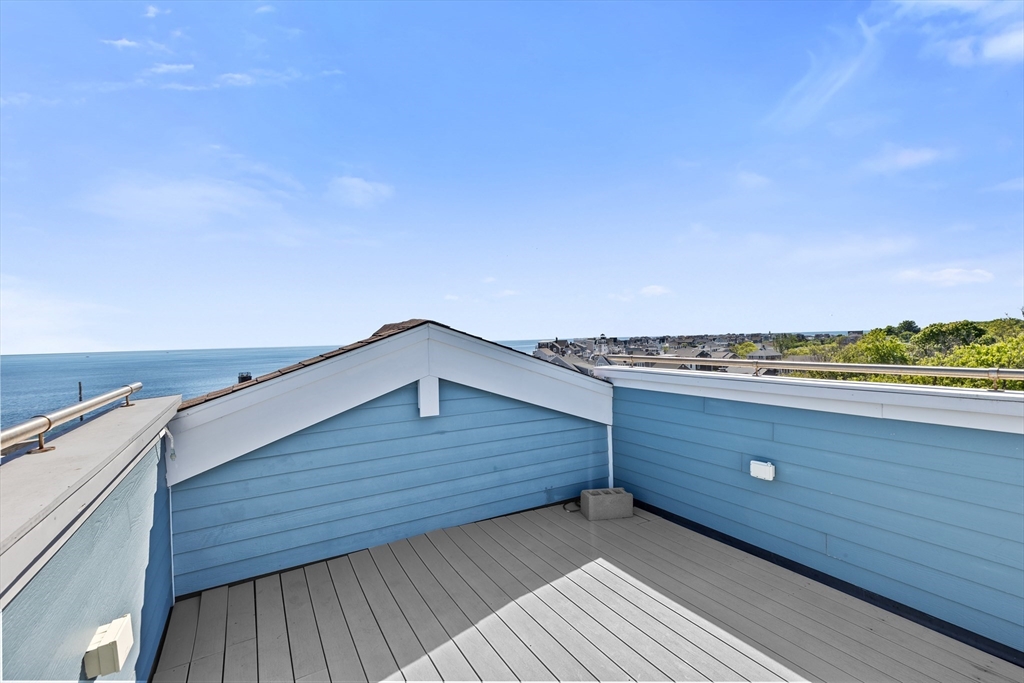 92 Marion Road, Unit LOWR Scituate, MA 02066 - Photo 17 of 18 a view of roof deck with wooden floor and fence