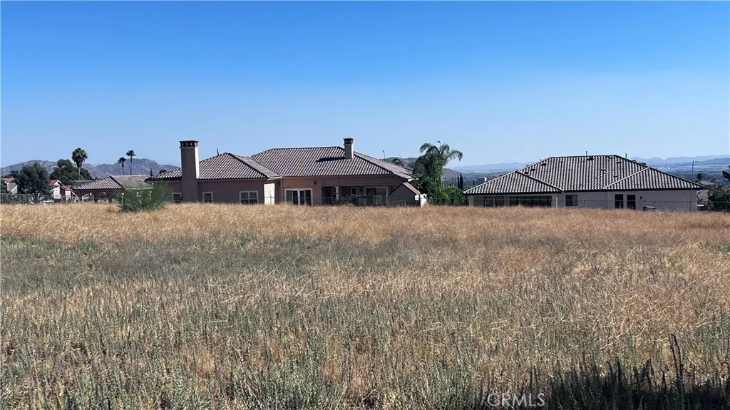 11560 Kitching Street Moreno Valley, CA 92557 - Photo 11 of 20 a front view of a house with a yard and seating