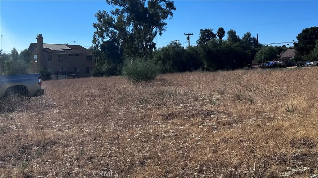 11560 Kitching Street Moreno Valley, CA 92557 - Photo 18 of 20 a view of a dry yard with wooden fence