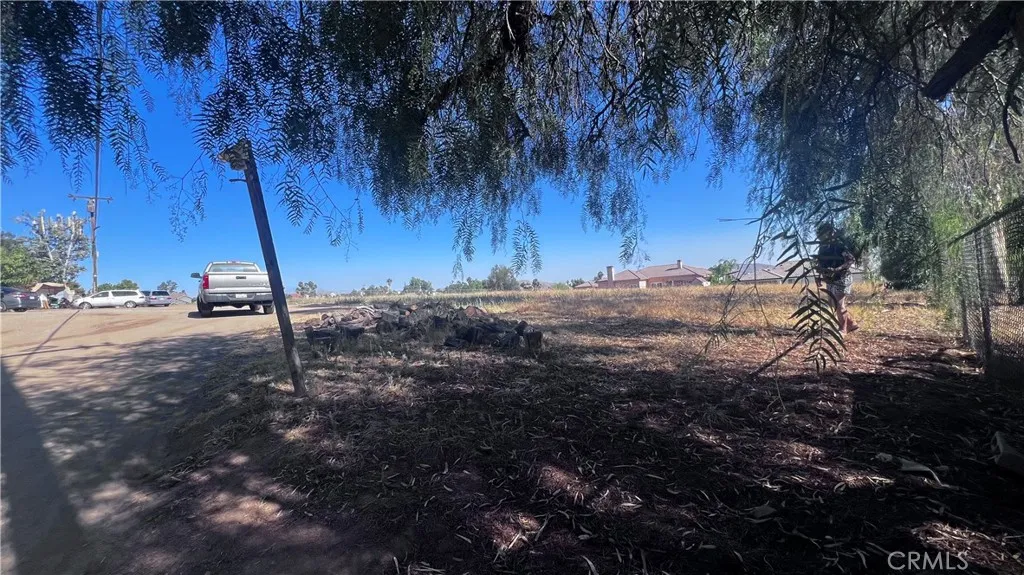 11560 Kitching Street Moreno Valley, CA 92557 - Photo 7 of 20 a view of dirt field with trees