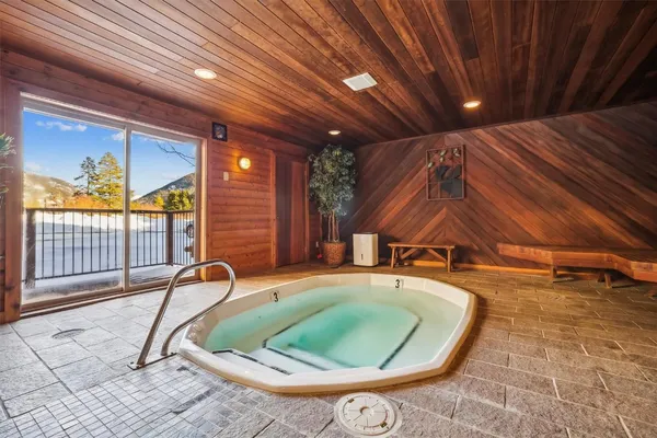 a view of a swimming pool with outdoor seating