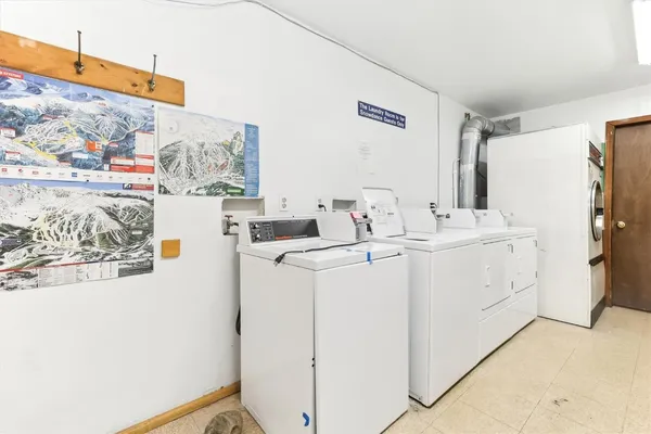 a view of a house with a snow in the yard
