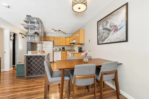 a view of a dining room with furniture and wooden floor