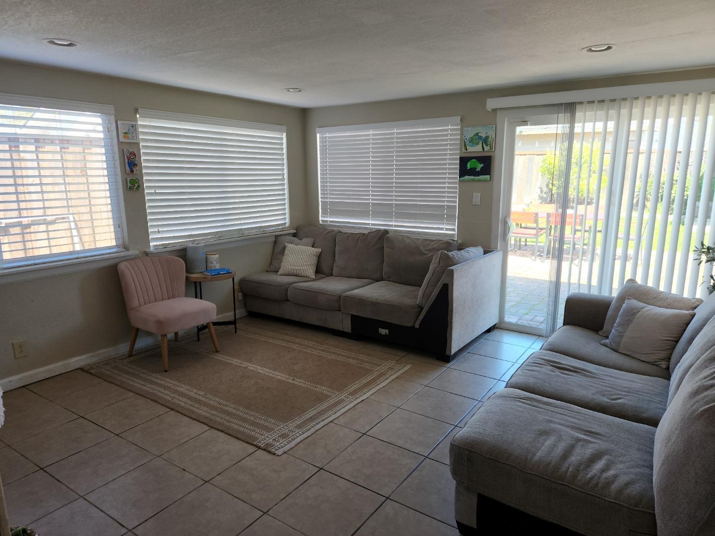 337 Reata Street Salinas, CA 93906 - Photo 6 of 11 a living room with furniture and large windows