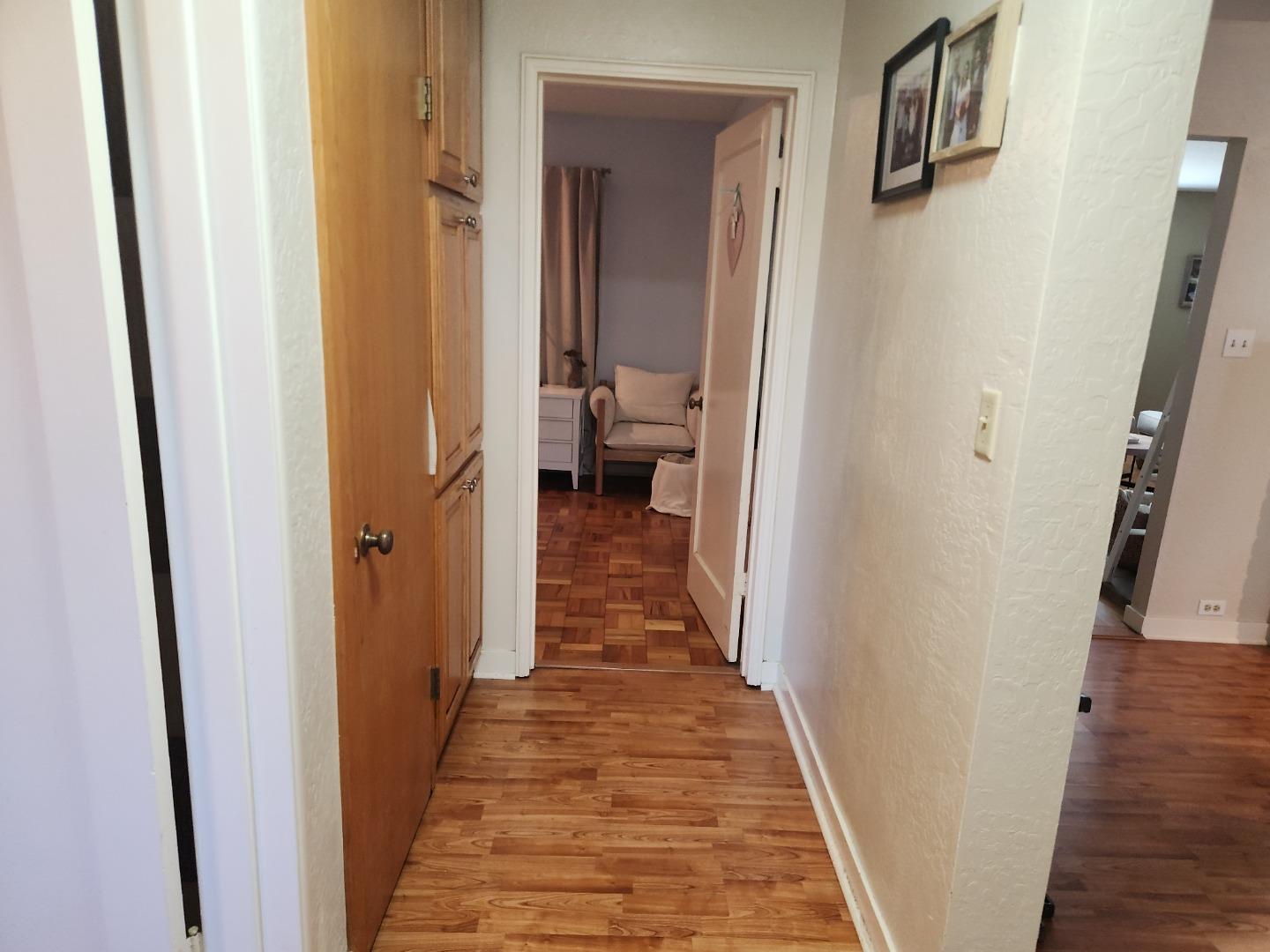 337 Reata Street Salinas, CA 93906 - Photo 9 of 11 a view of a hallway with wooden floor and a living room