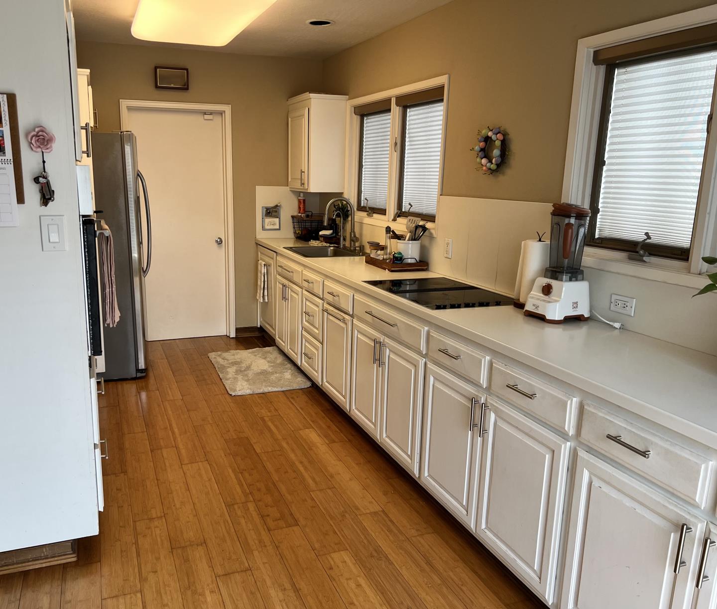 337 Reata Street Salinas, CA 93906 - Photo 10 of 11 a kitchen with stainless steel appliances a sink and wooden floor