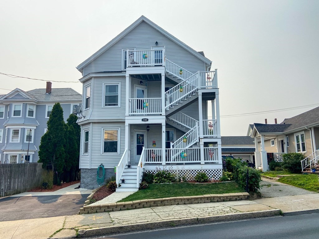 1141 Stafford Road Fall River, MA 02721 - Photo 1 of 30 a front view of a house with a yard