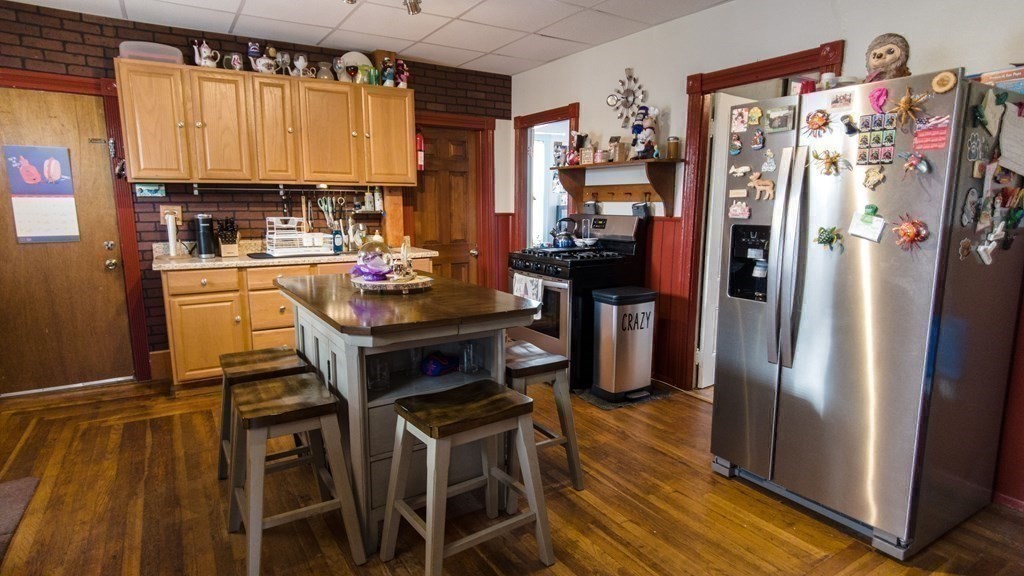 1141 Stafford Road Fall River, MA 02721 - Photo 12 of 30 a kitchen with stainless steel appliances a refrigerator and a stove