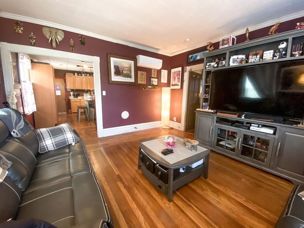 1141 Stafford Road Fall River, MA 02721 - Photo 14 of 30 a living room with furniture and a flat screen tv