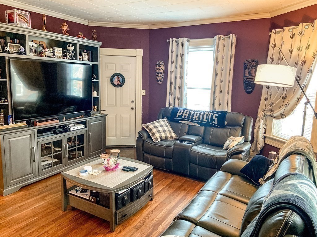 1141 Stafford Road Fall River, MA 02721 - Photo 15 of 30 a living room with furniture and a flat screen tv