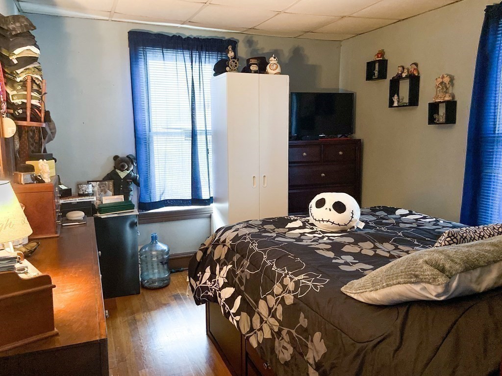 1141 Stafford Road Fall River, MA 02721 - Photo 16 of 30 a bedroom with a bed and dresser