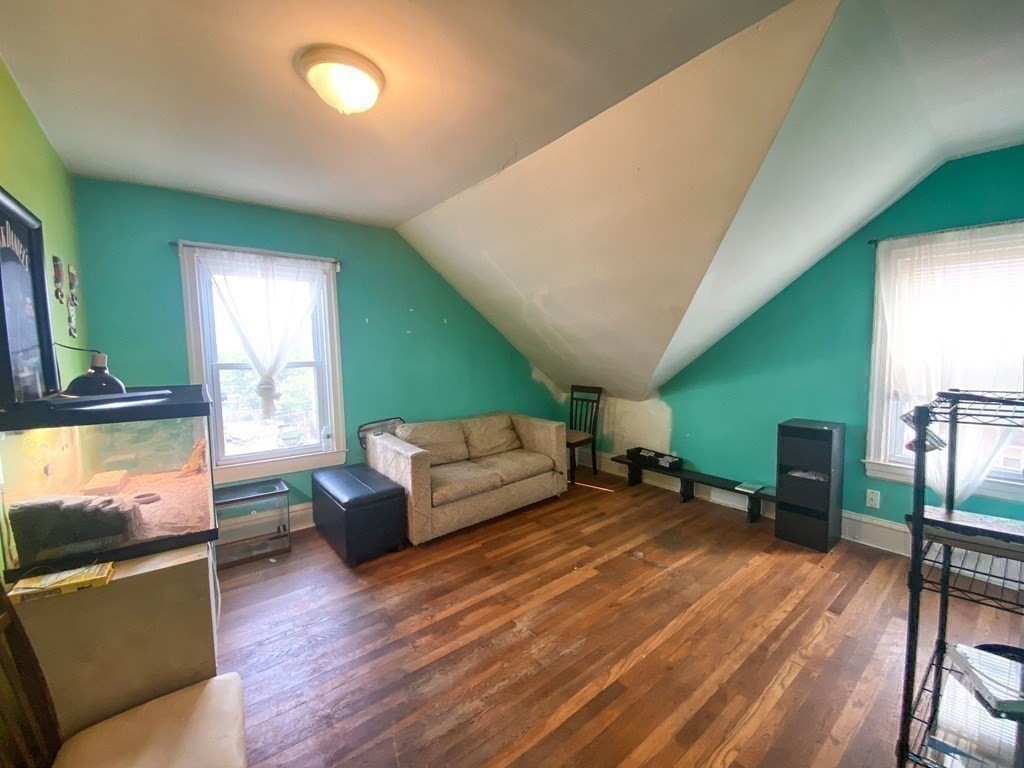 1141 Stafford Road Fall River, MA 02721 - Photo 22 of 30 a living room with furniture and a flat screen tv