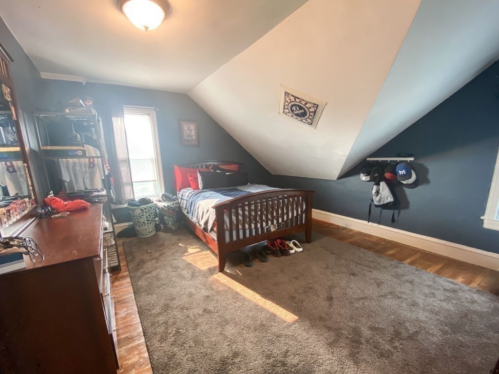 1141 Stafford Road Fall River, MA 02721 - Photo 23 of 30 a living room with a bed furniture and a window