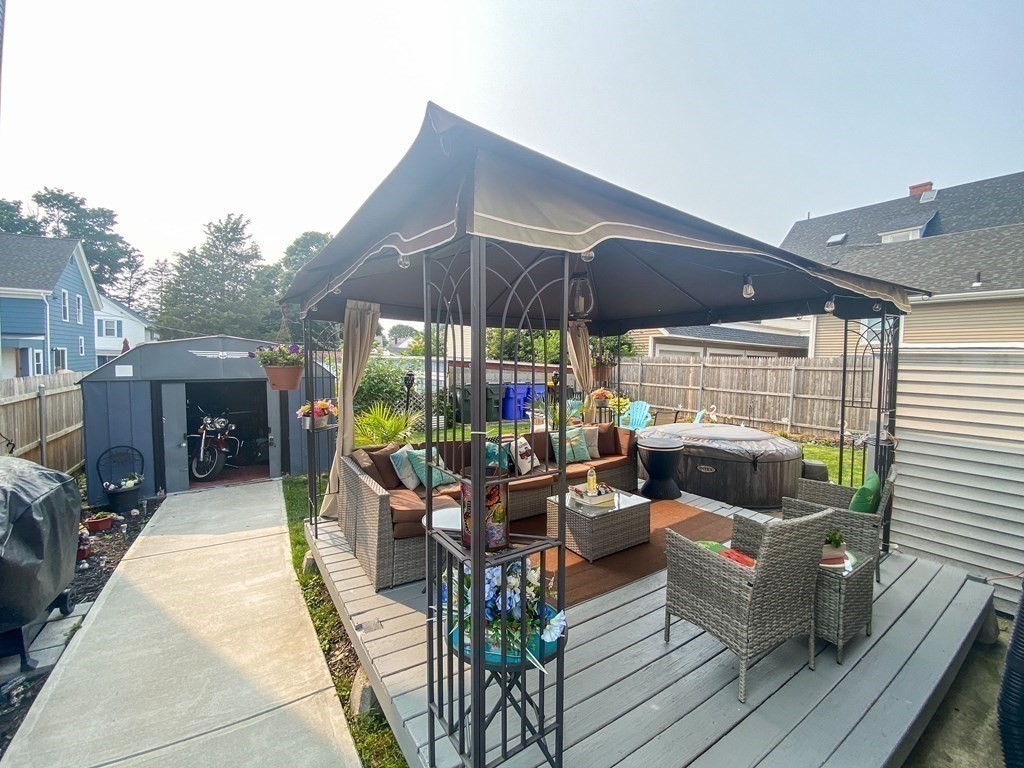 1141 Stafford Road Fall River, MA 02721 - Photo 28 of 30 a view of a patio with a dining table and chairs