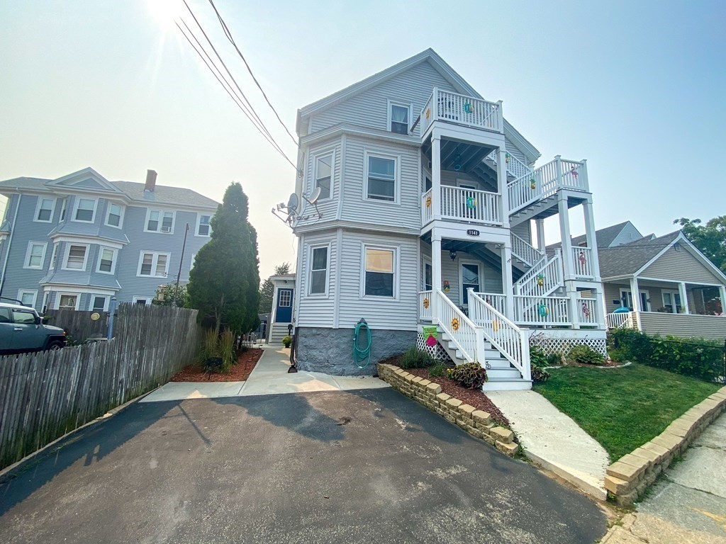 1141 Stafford Road Fall River, MA 02721 - Photo 3 of 30 a front view of a house with a yard