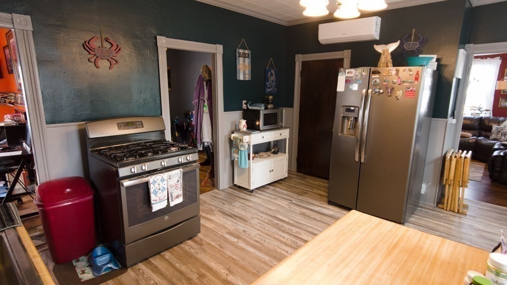 1141 Stafford Road Fall River, MA 02721 - Photo 4 of 30 a kitchen with stainless steel appliances a refrigerator and a stove
