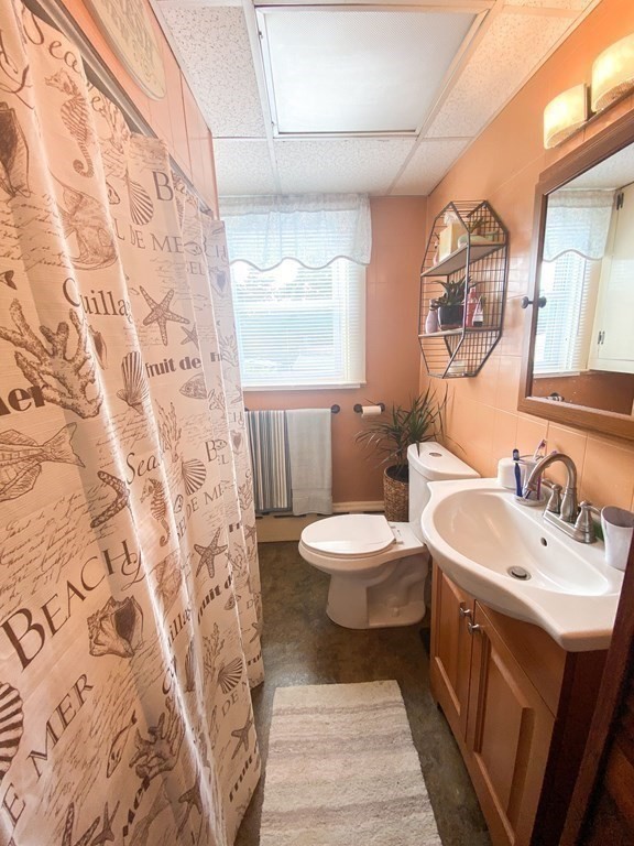 1141 Stafford Road Fall River, MA 02721 - Photo 8 of 30 a bathroom with a sink and a mirror