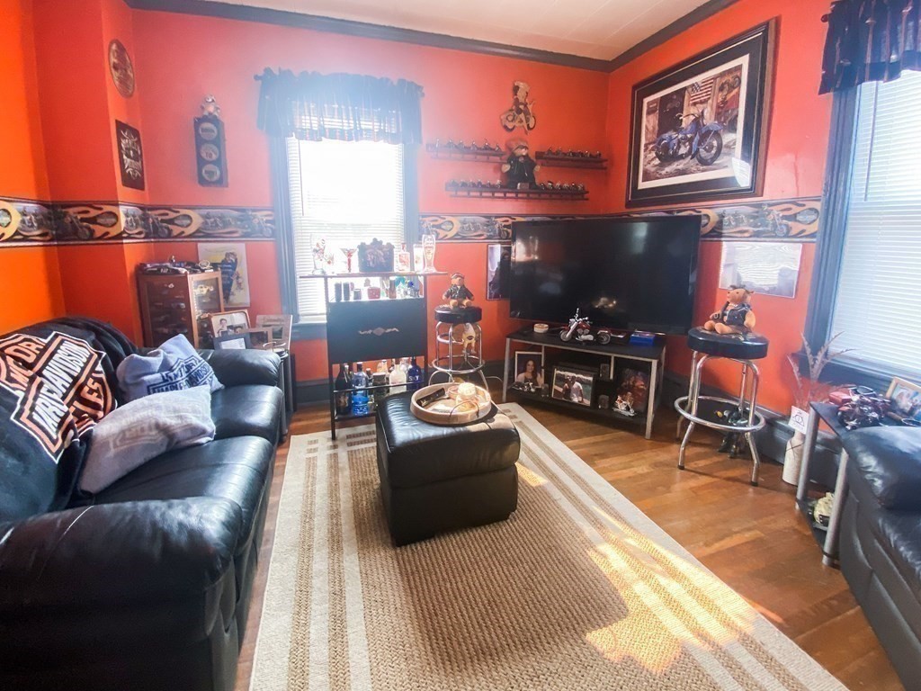 1141 Stafford Road Fall River, MA 02721 - Photo 9 of 30 a living room with furniture and a flat screen tv