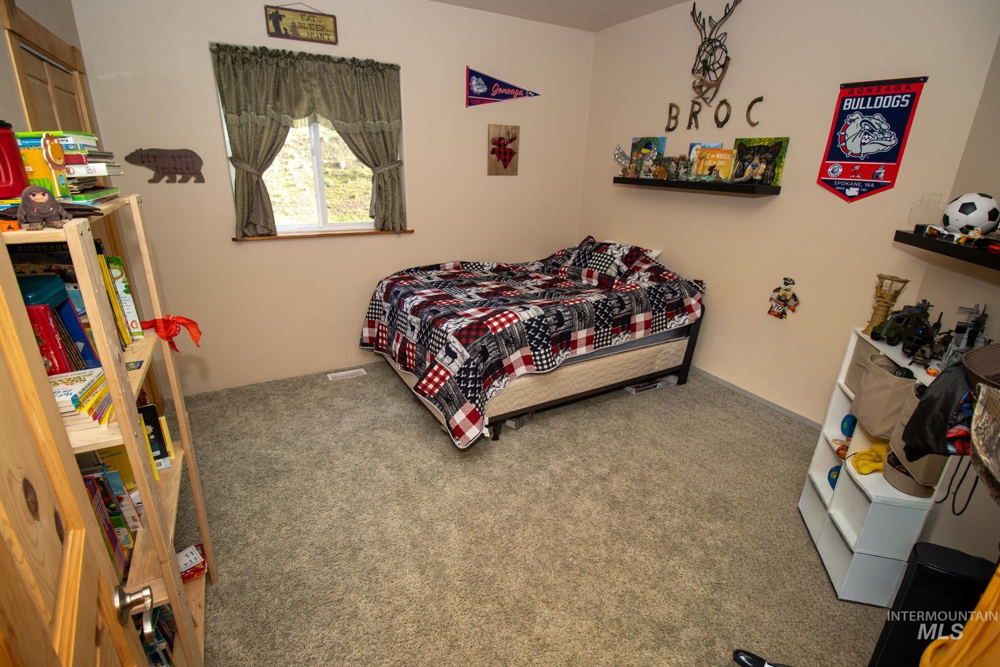 237 Old Dent Road Orofino, ID 83544 - Photo 23 of 48 Bedroom with carpet flooring