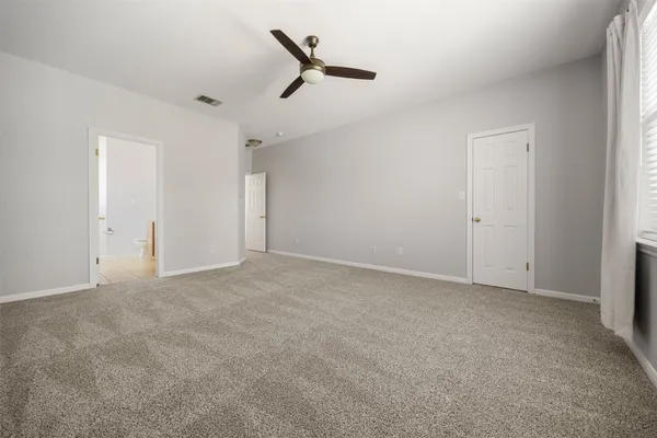 a view of an empty room with a window