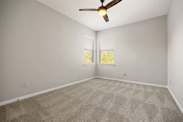 a living room filled with furniture and a chandelier