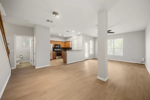 an empty room with windows and entrance