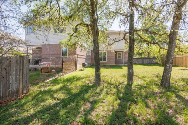 a view of a park with swings and slides