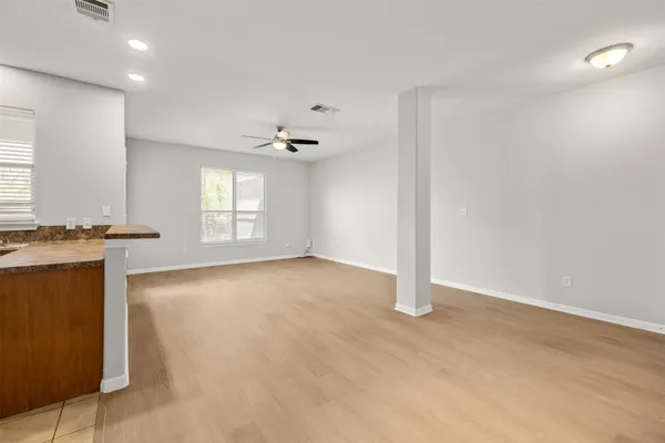 a kitchen with stainless steel appliances a refrigerator sink and microwave