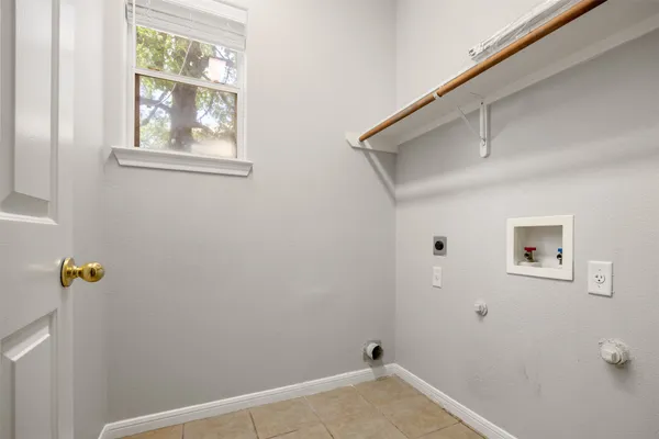 a bathroom with a granite countertop sink a mirror bathtub and shower