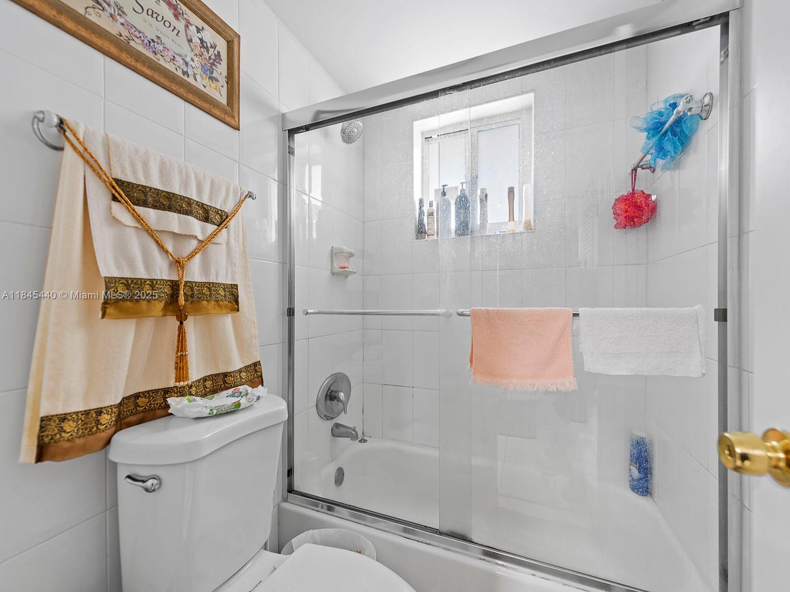 2690 Southwest 22nd Avenue, Unit 507 Miami, FL 33133 - Photo 13 of 20 a bathroom with a bathtub and a shower