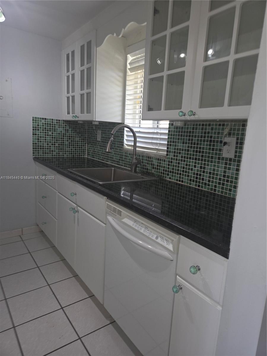 2690 Southwest 22nd Avenue, Unit 507 Miami, FL 33133 - Photo 17 of 20 a bathroom with a sink and a shower