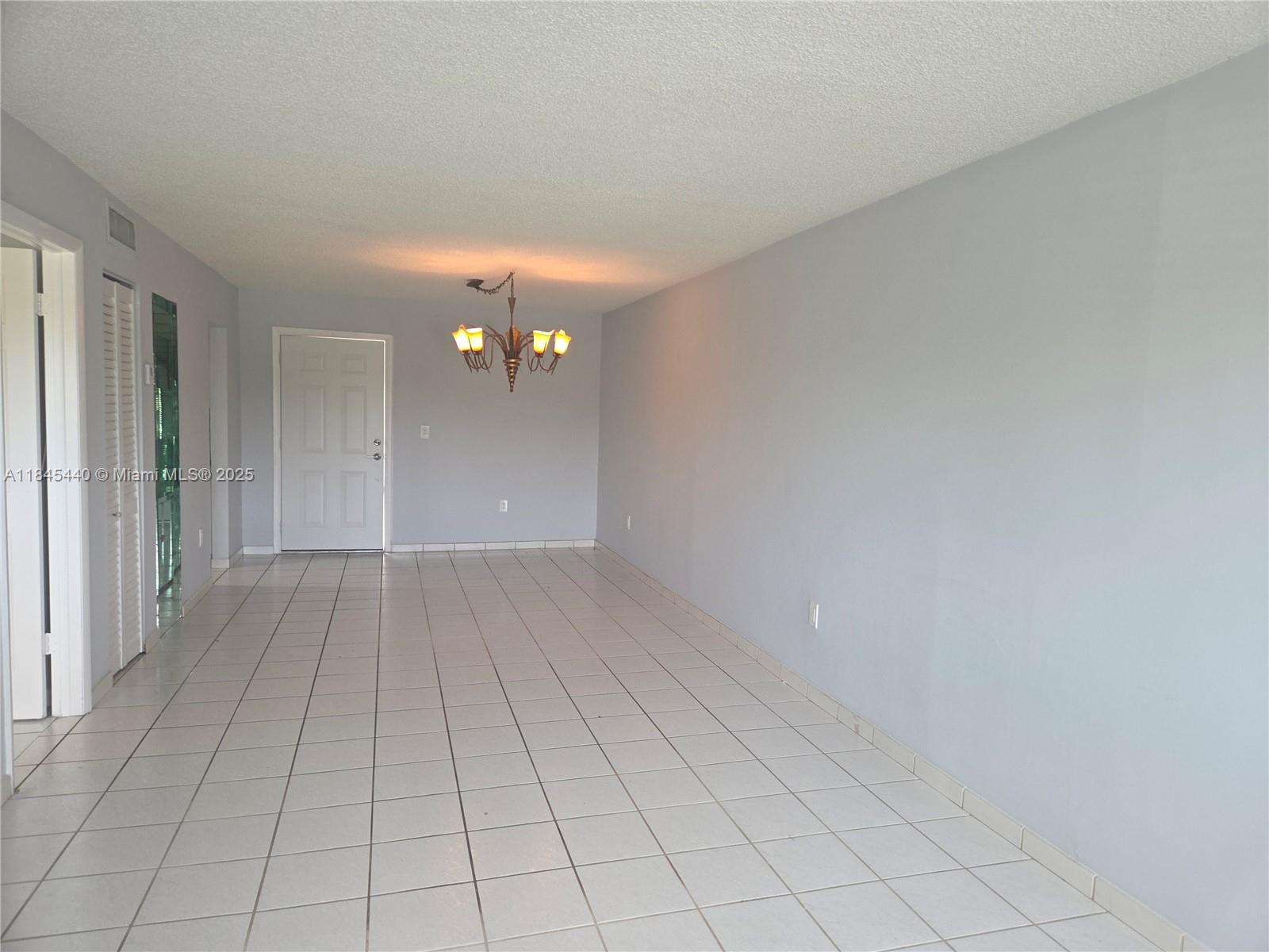 2690 Southwest 22nd Avenue, Unit 507 Miami, FL 33133 - Photo 19 of 20 wooden floor in an empty room with a window