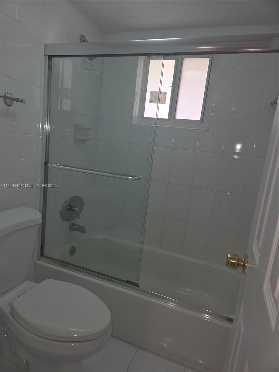 2690 Southwest 22nd Avenue, Unit 507 Miami, FL 33133 - Photo 20 of 20 a bathroom with a toilet and a shower