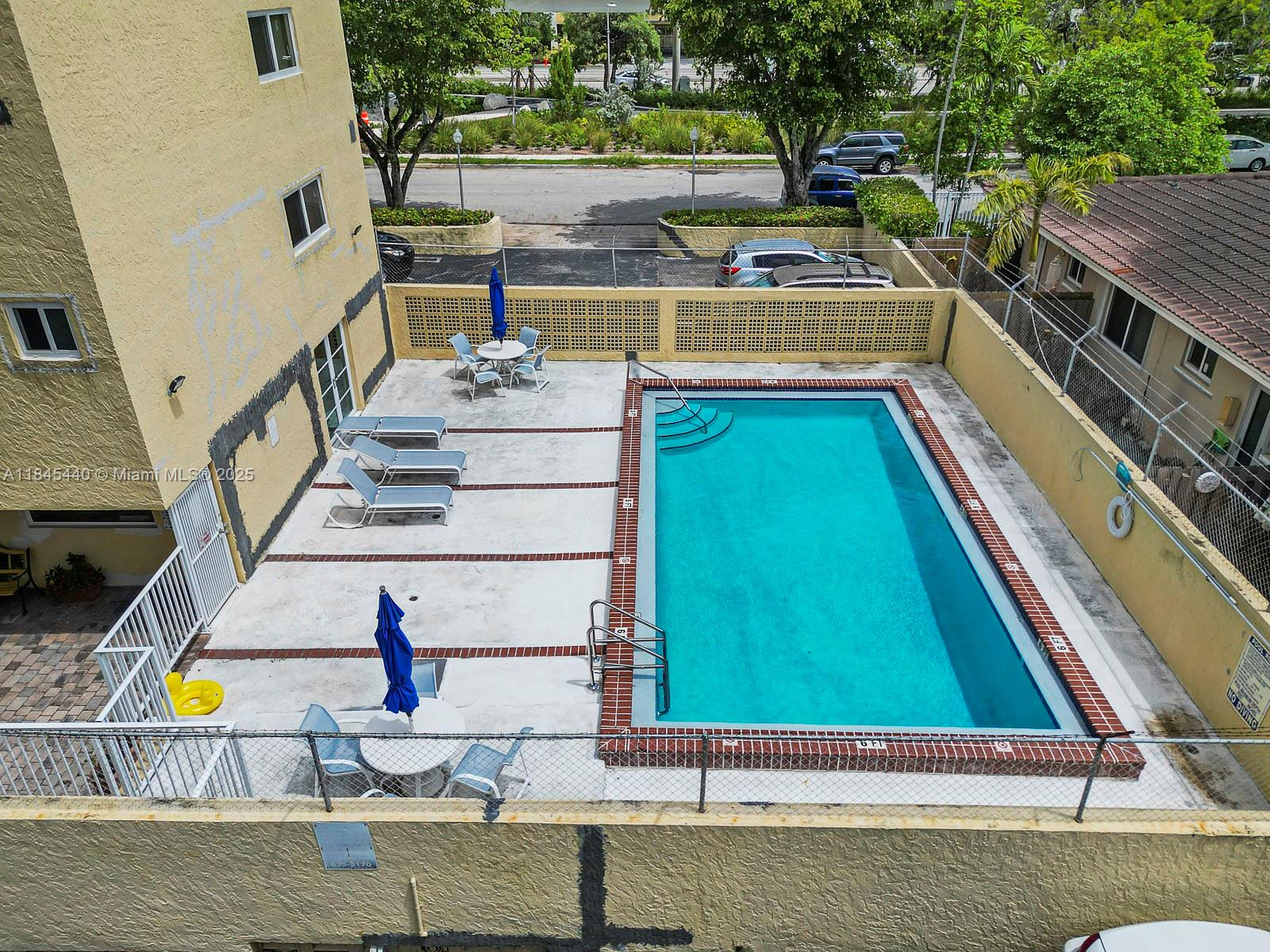 2690 Southwest 22nd Avenue, Unit 507 Miami, FL 33133 - Photo 5 of 20 a view of swimming pool with a lounge chairs