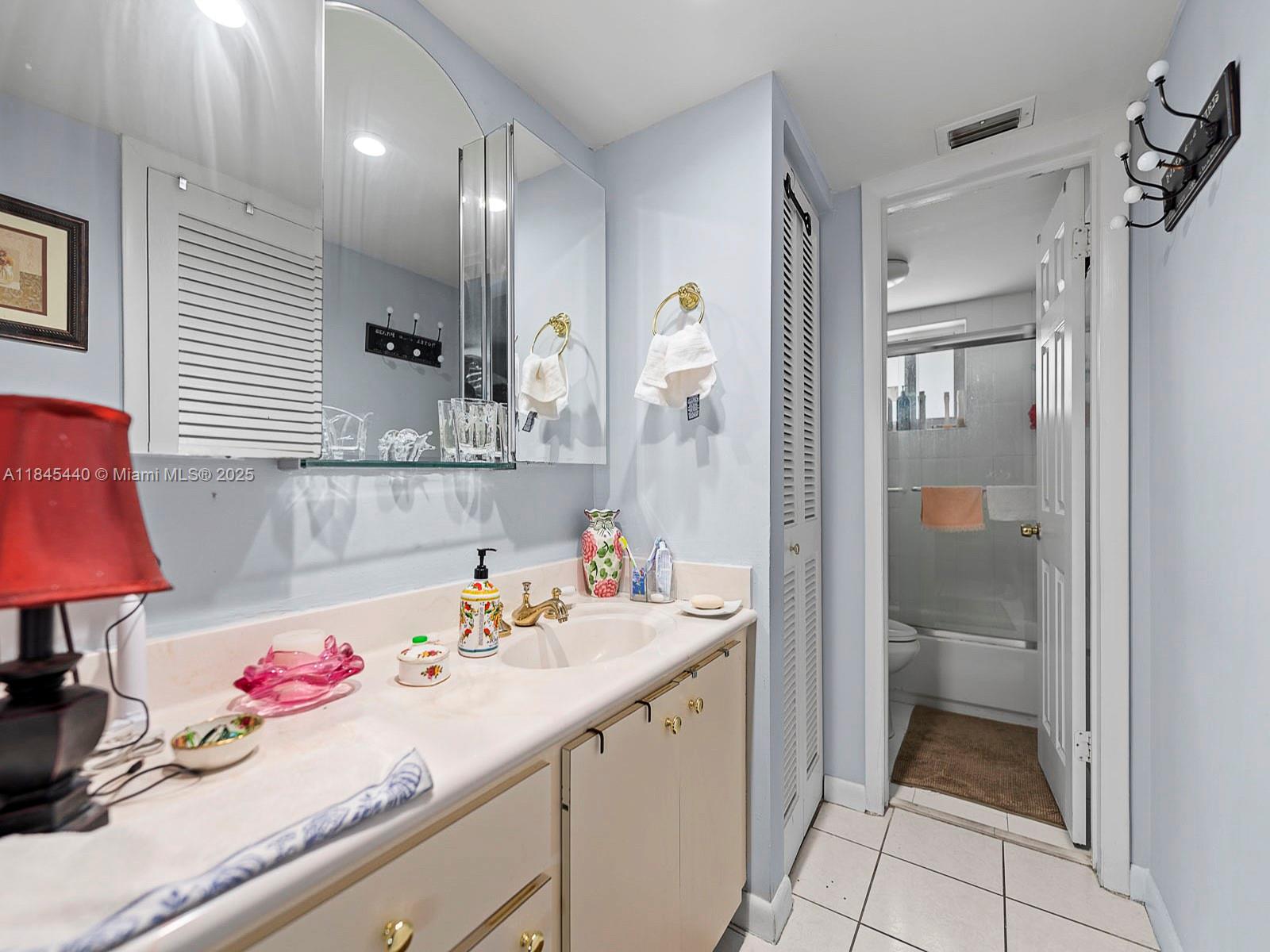 2690 Southwest 22nd Avenue, Unit 507 Miami, FL 33133 - Photo 6 of 20 a bathroom with a sink vanity tub and shower