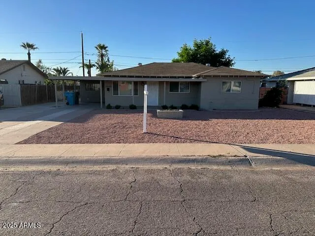 a front view of a house with a yard and a garage
