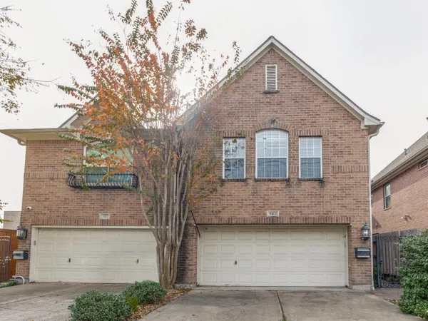 a front view of a house with garage