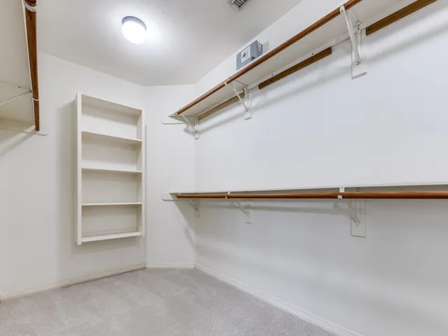 a view of an empty walk in closet